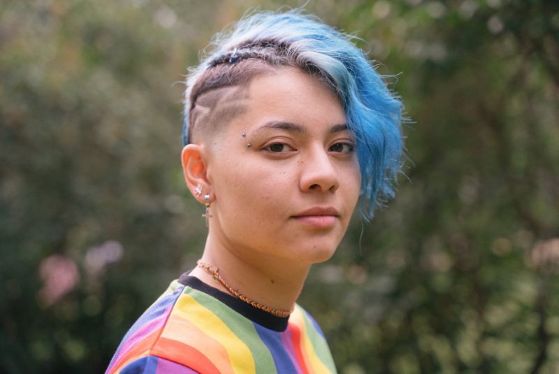 Trans young person looking at camera