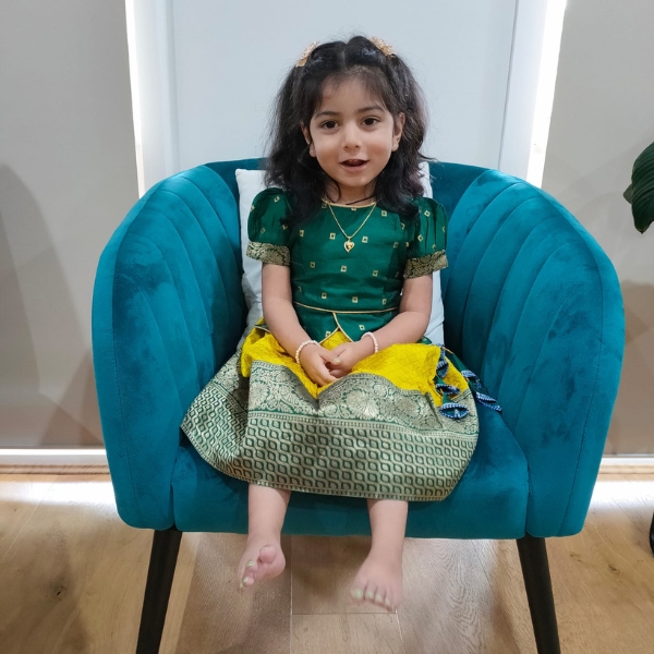 Muscular dystrophy patient Ivani sitting on a chair