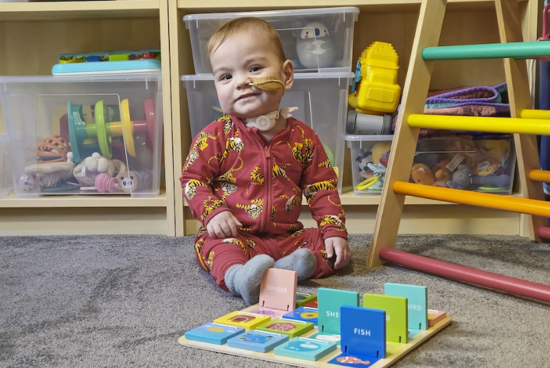 Chronic lung disease patient Atticus at home with toys