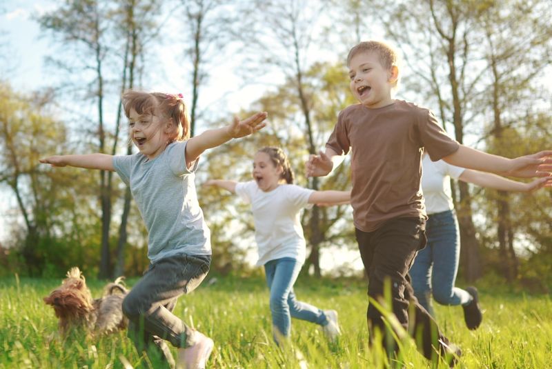 Children running in the grass