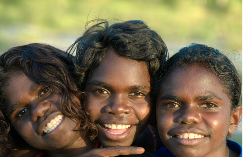 Indigenous children smiling at camera
